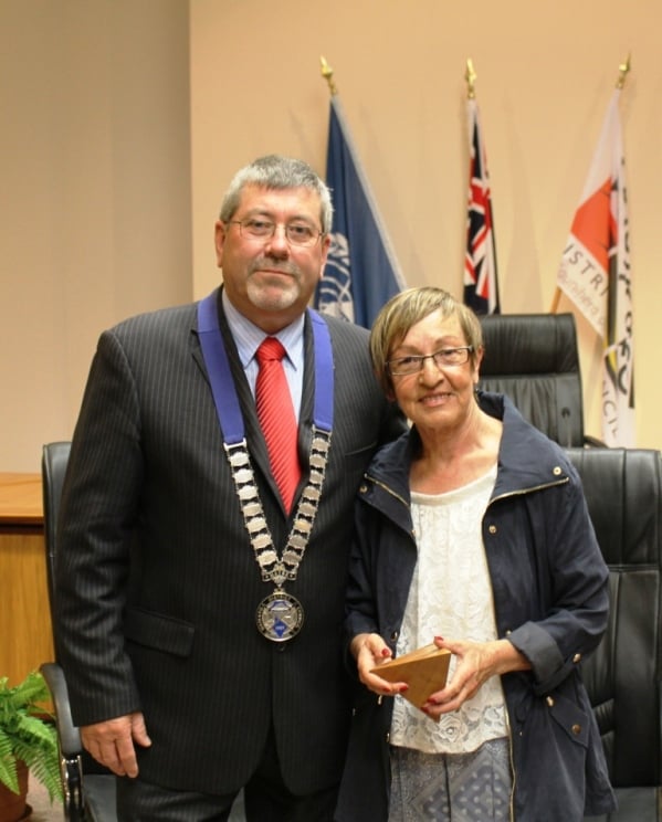 Angela receives her award from Waikato Mayor Allan Sanson