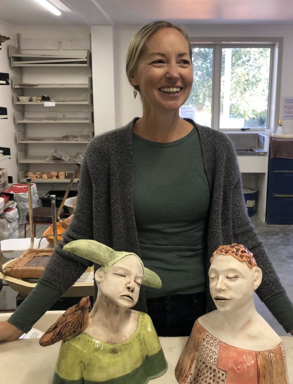 Justine Davies with 2 bust sculptures